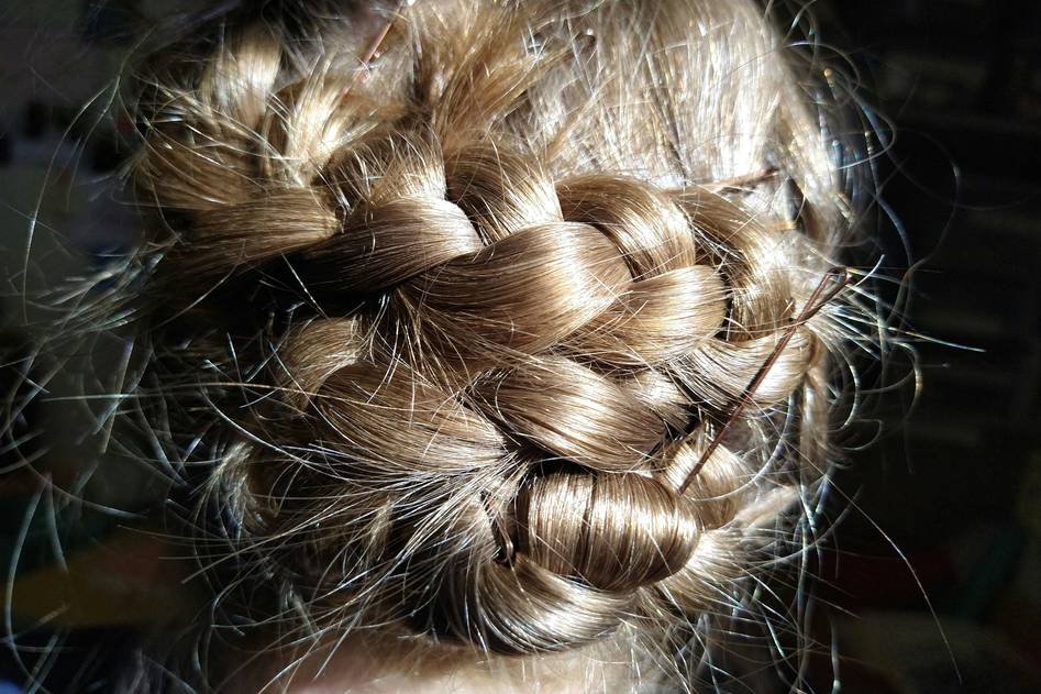 Close-up of intricate braided updo with delicate accessories