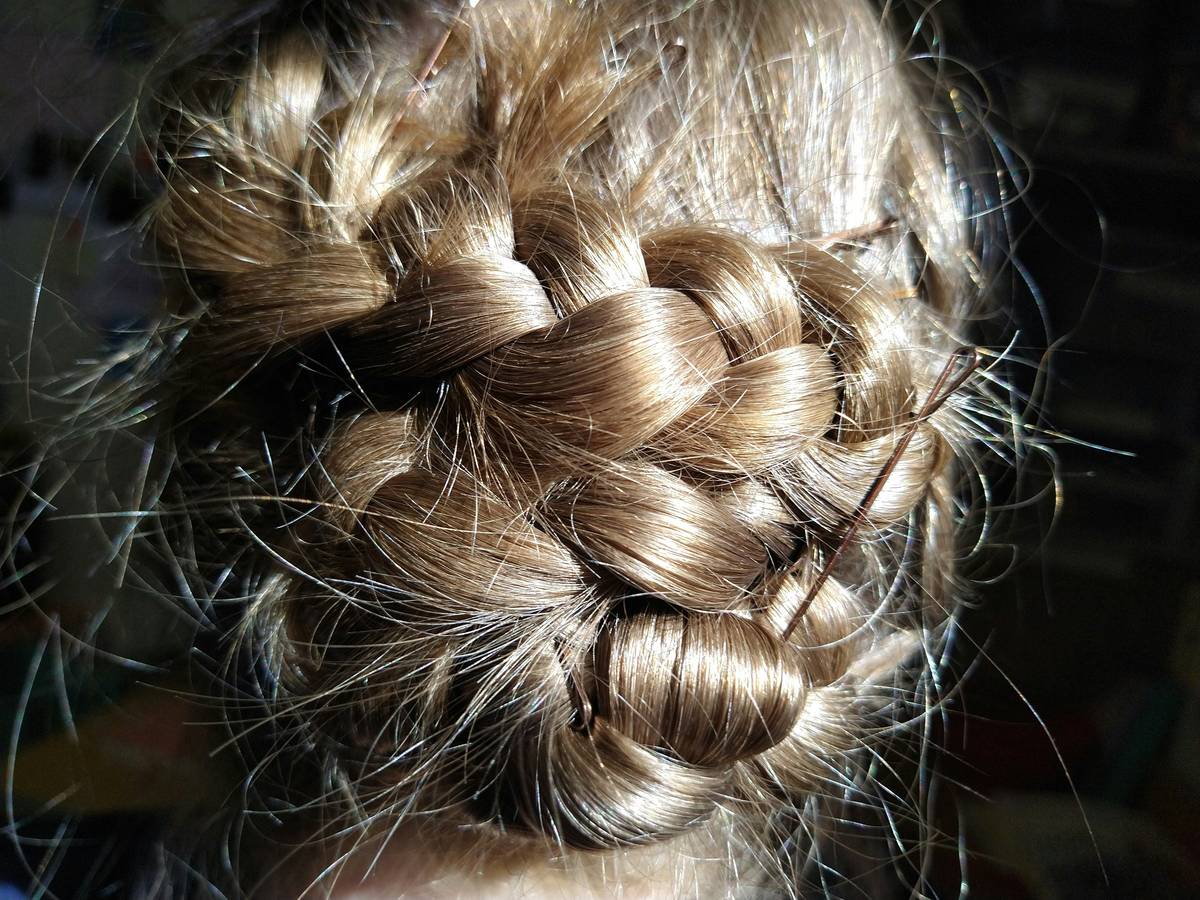 Finished Bridal Updos showcasing natural movement and secure structure under lighting